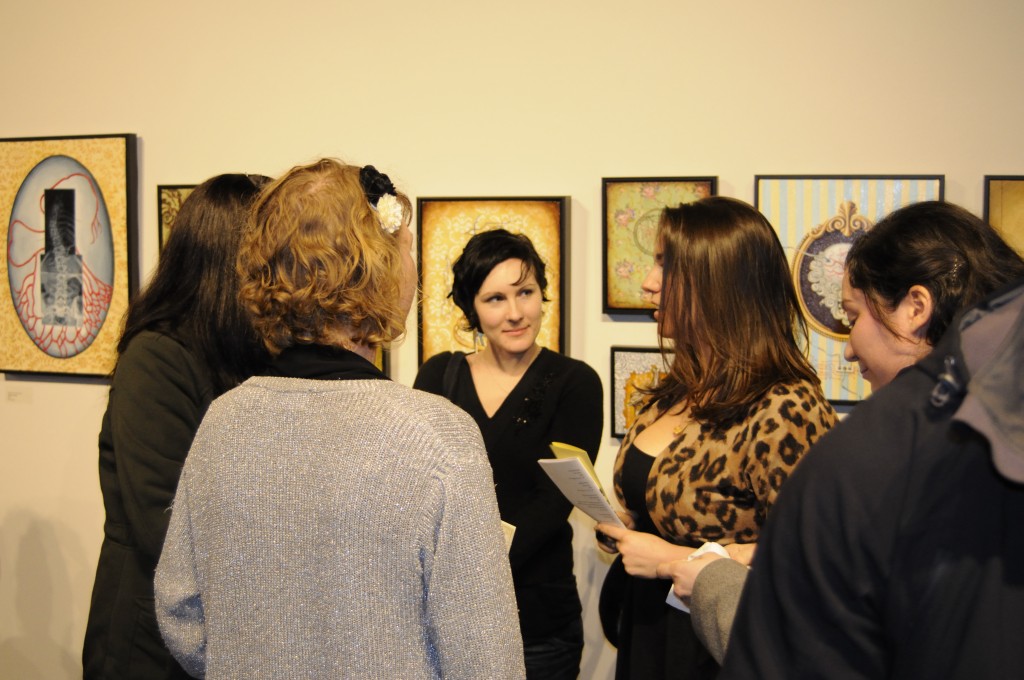KAC Gallery visitors discuss an art exhibition