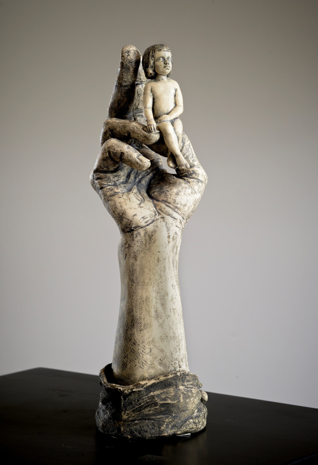 Kathleen Skeels, Child in Hand, ceramic, porcelain